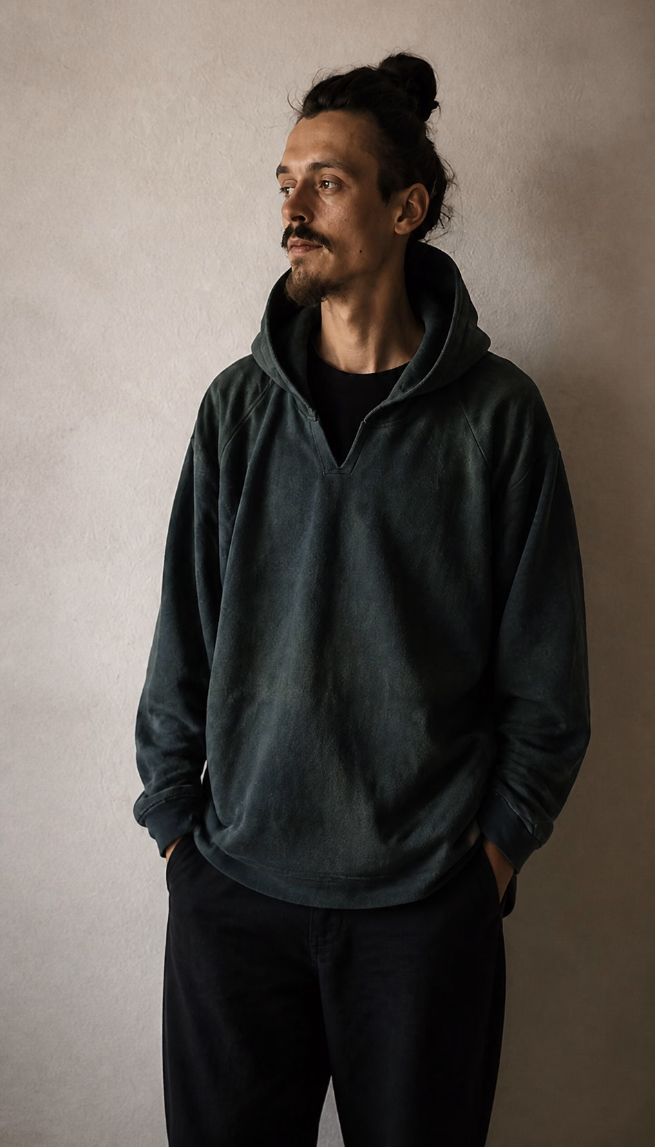 Forest green hemp hoodie worn outdoors
