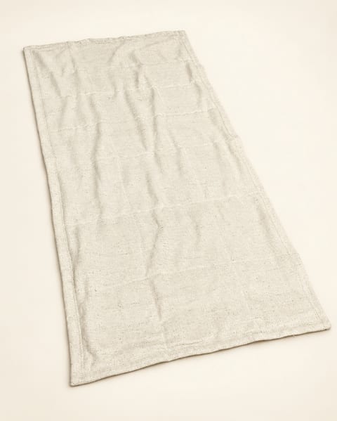Rectangular woven textile in ivory, front view